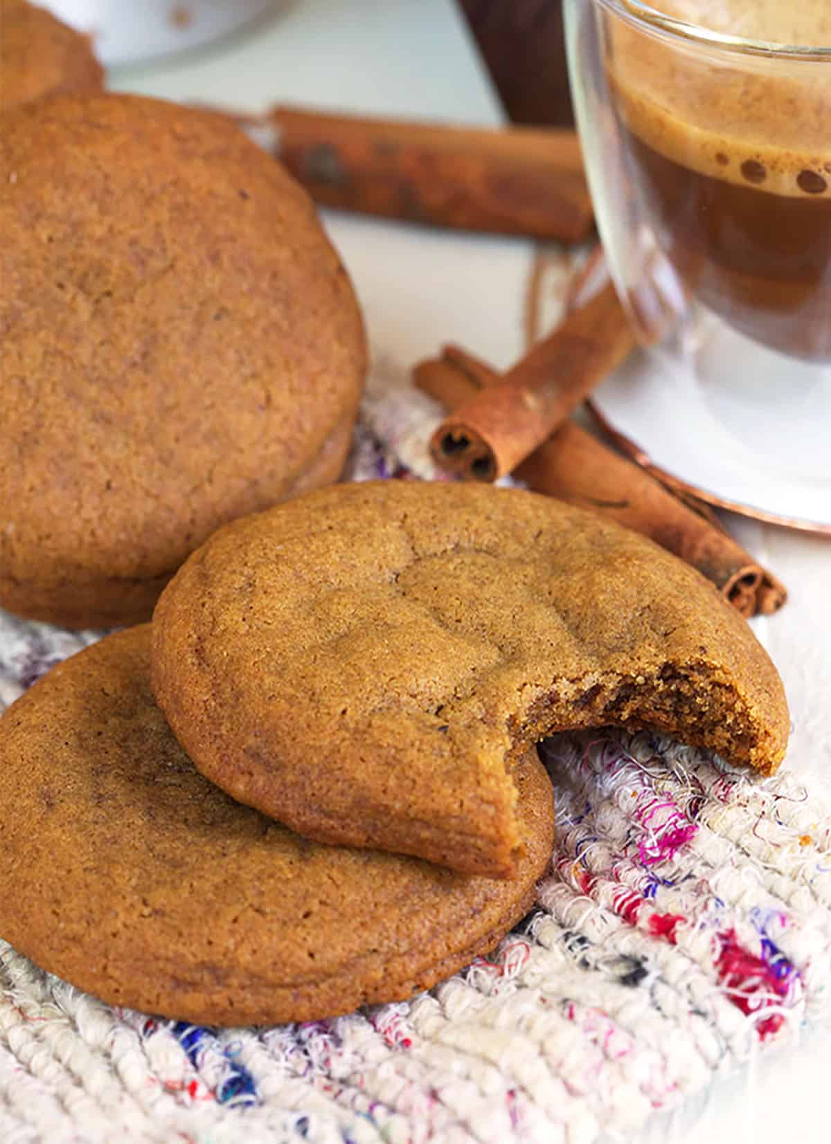 Ginger snap cookies on a tweed blanket.