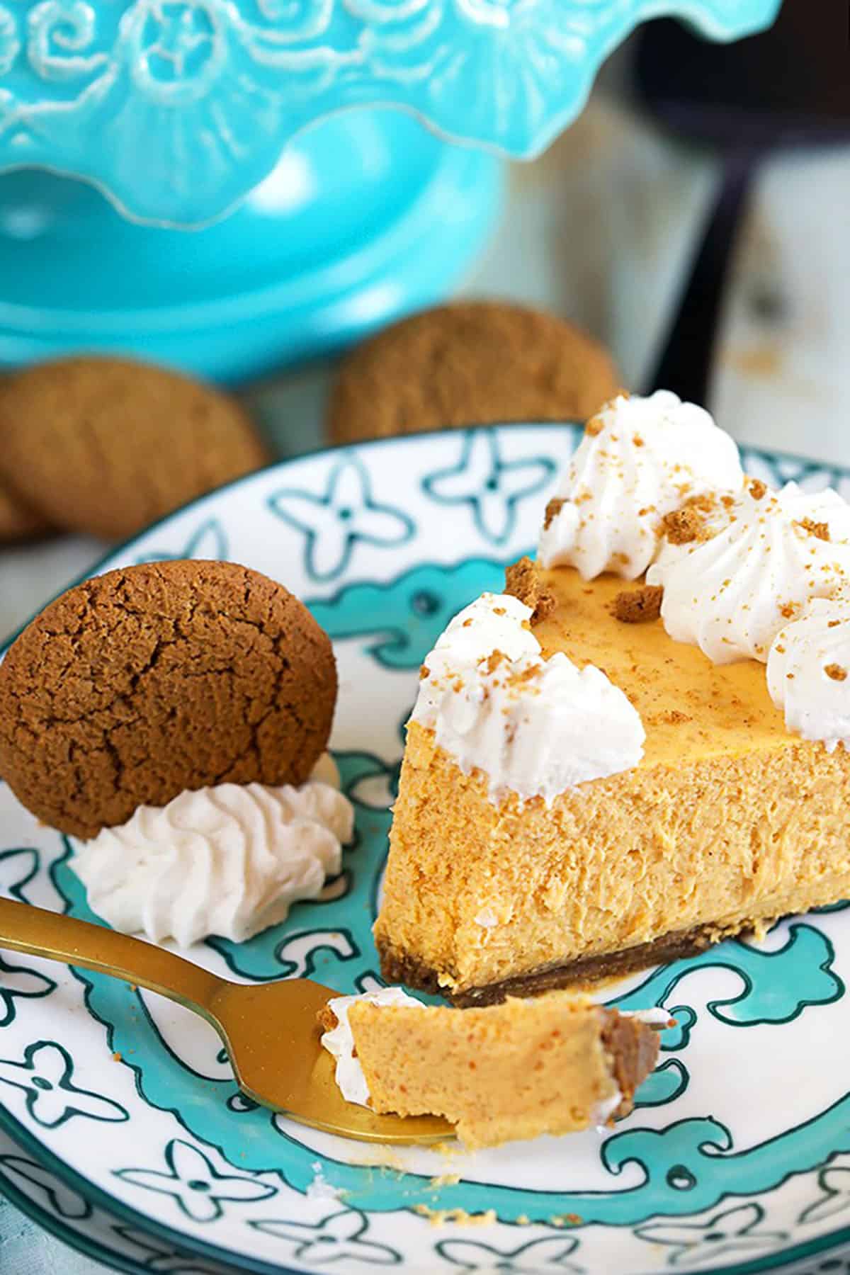 Slice of Pumpkin Cheesecake with a bite on a fork.