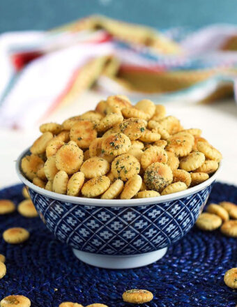 Ranch seasoned oyster crackers in a blue and white bowl.
