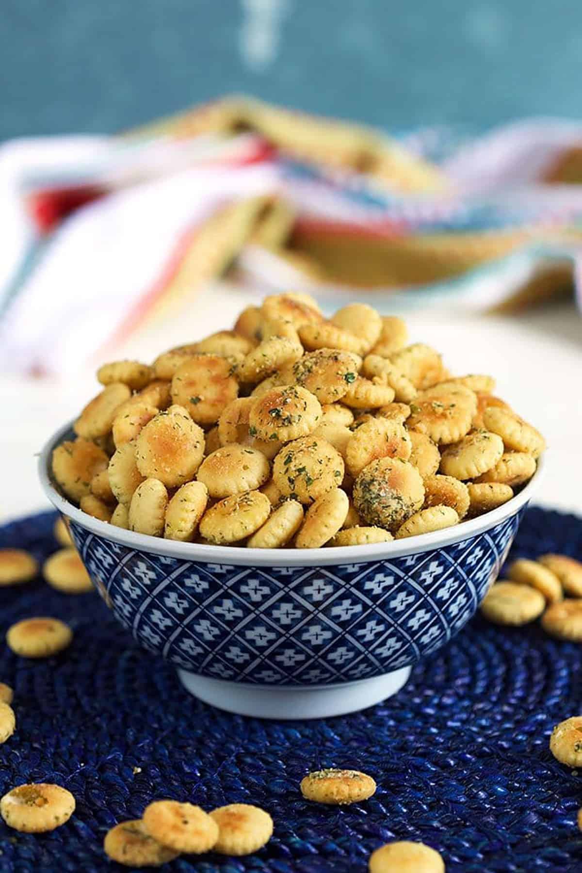 Ranch seasoned oyster crackers in a blue and white bowl.