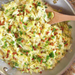 Overhead shot of fried cabbage in a skillet.