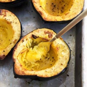 A fork is scooping out some of the acorn squash.