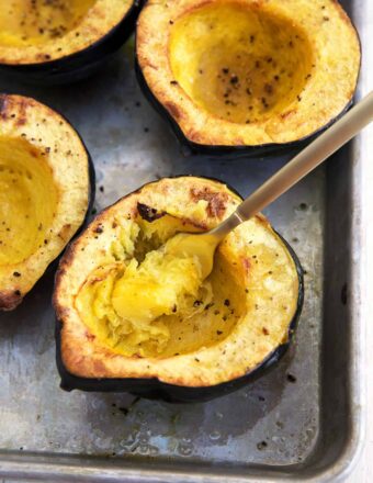 A fork is scooping out some of the acorn squash.