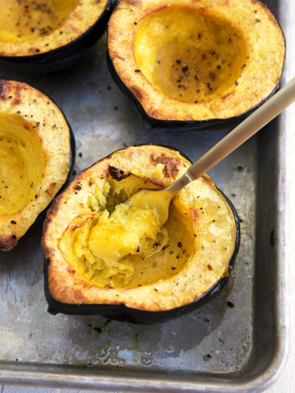 A fork is scooping out some of the acorn squash.