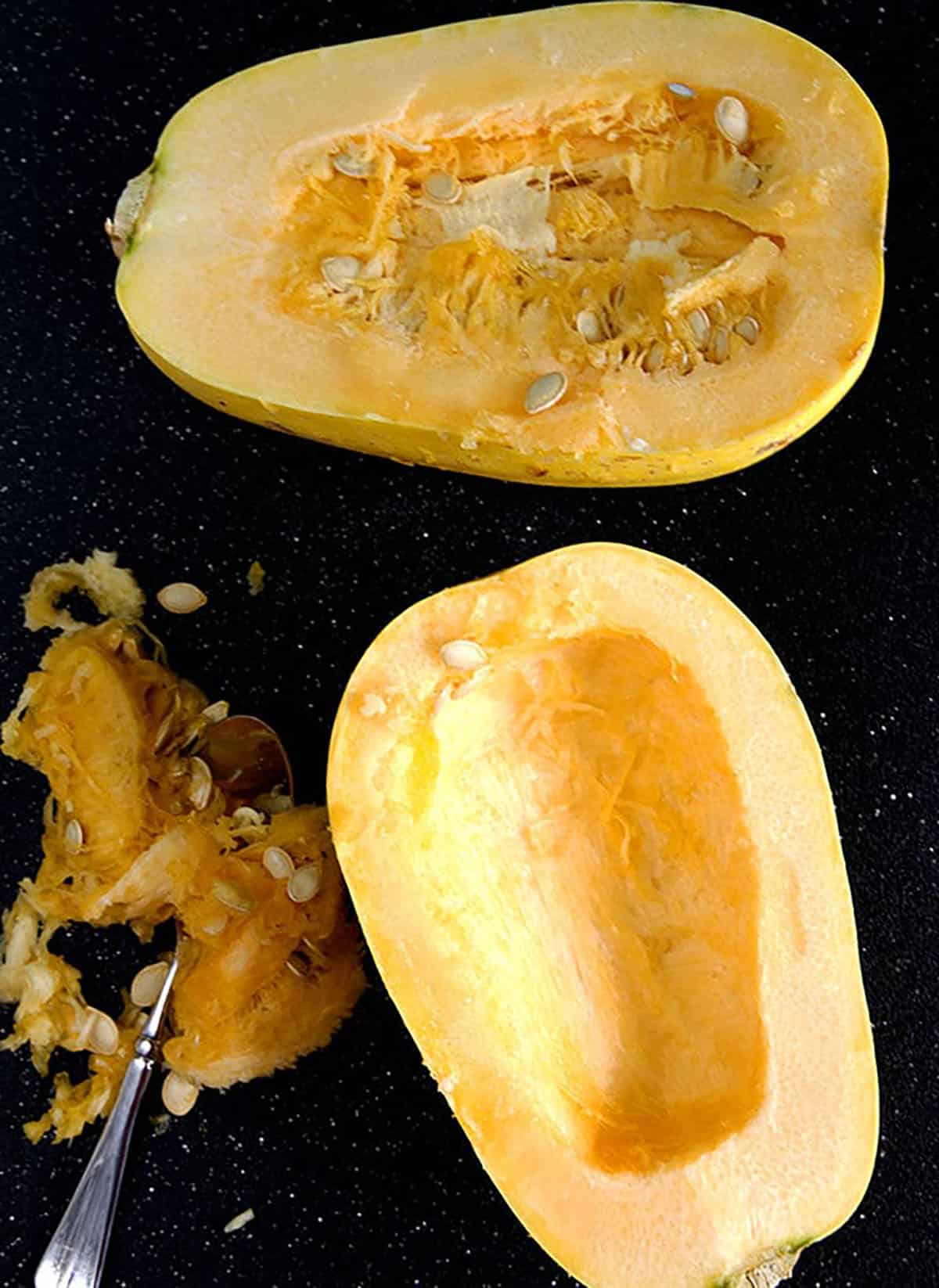 Seeds have been scooped out of half a squash.