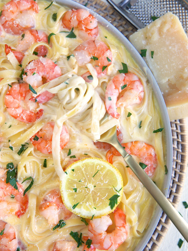 A fork is twilring a small serving of noodles.