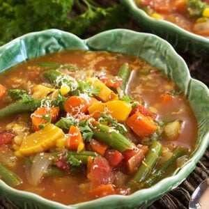 Veggies are piled high in a rich brown broth.