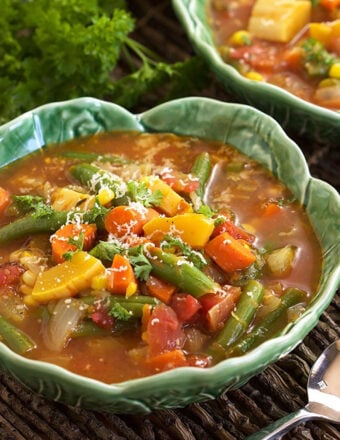 Veggies are piled high in a rich brown broth.