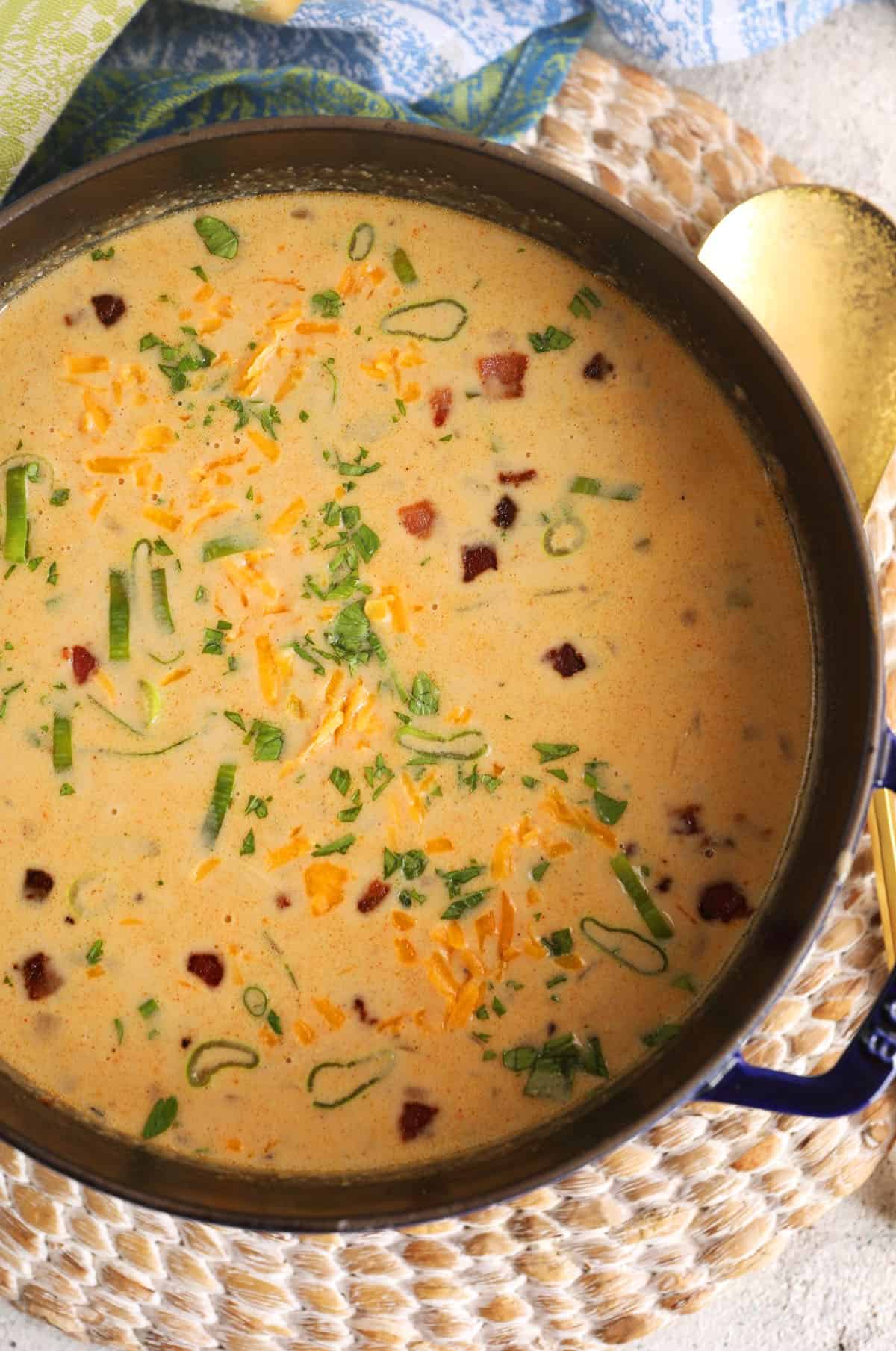 Overhead view of loaded potato soup in slow cooker