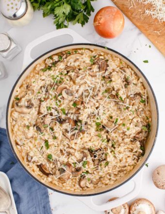 A pan is filled with cooked mushroom risotto.