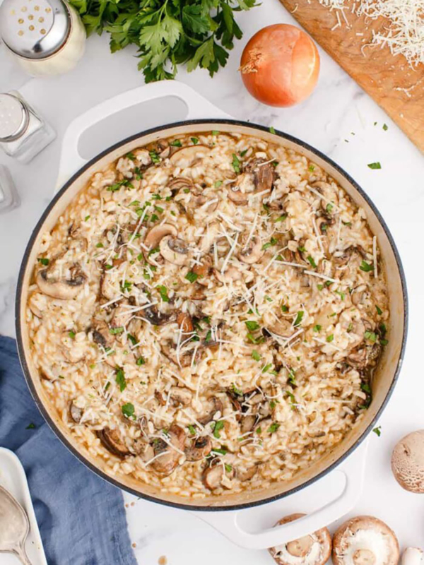 A pan is filled with cooked mushroom risotto.