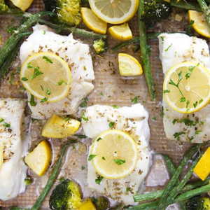 Baked Cod on a sheet pan with asparagus, squash and lemons