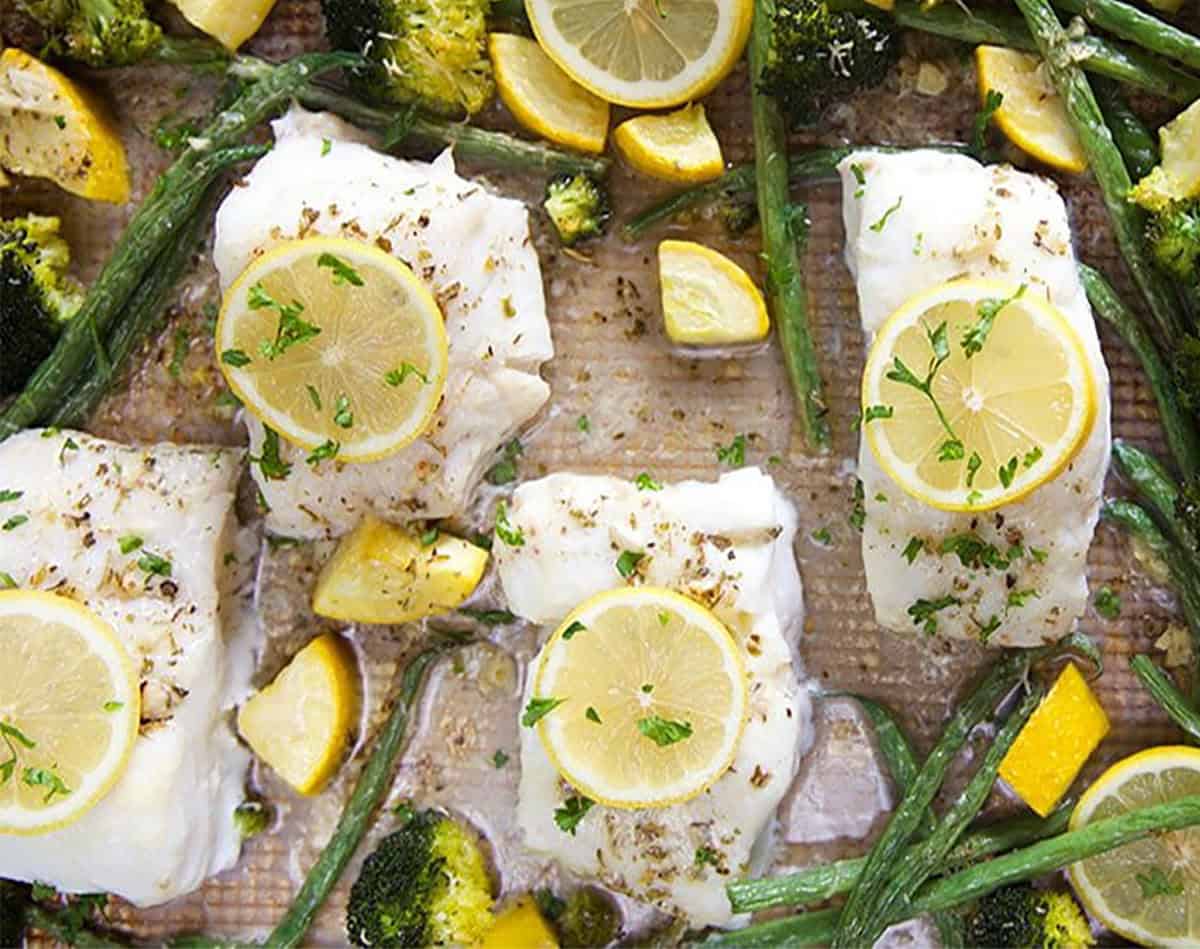 Baked Cod on a sheet pan with asparagus, squash and lemons