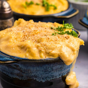 A bowl is filled with gooey mac and cheese.
