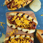 Overhead shot of three chili cheese dogs