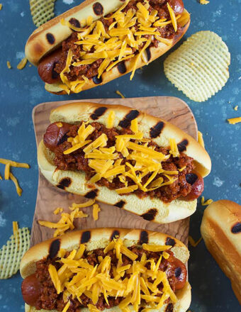 Overhead shot of three chili cheese dogs