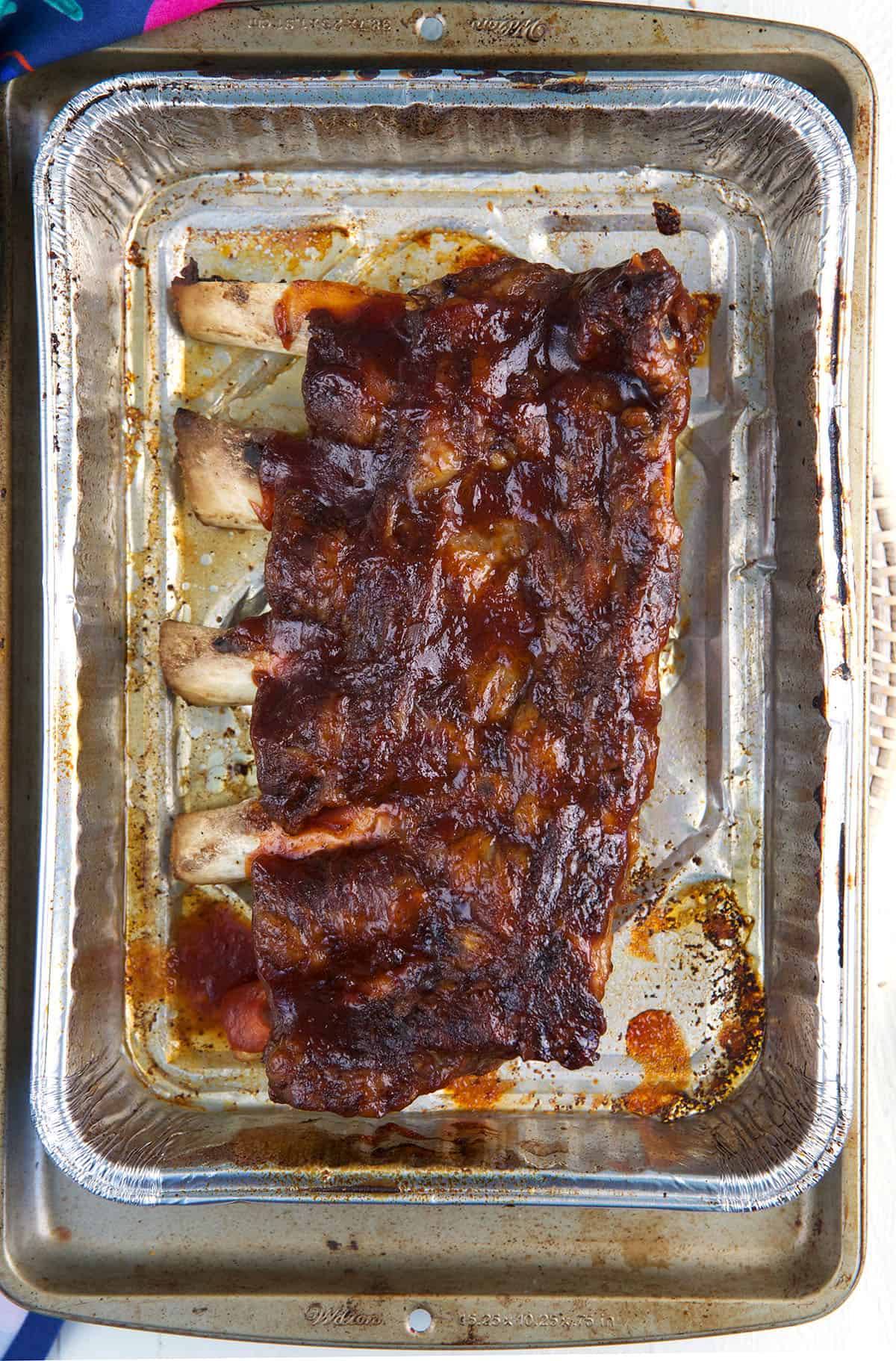 Ribs are presented in a baking dish.