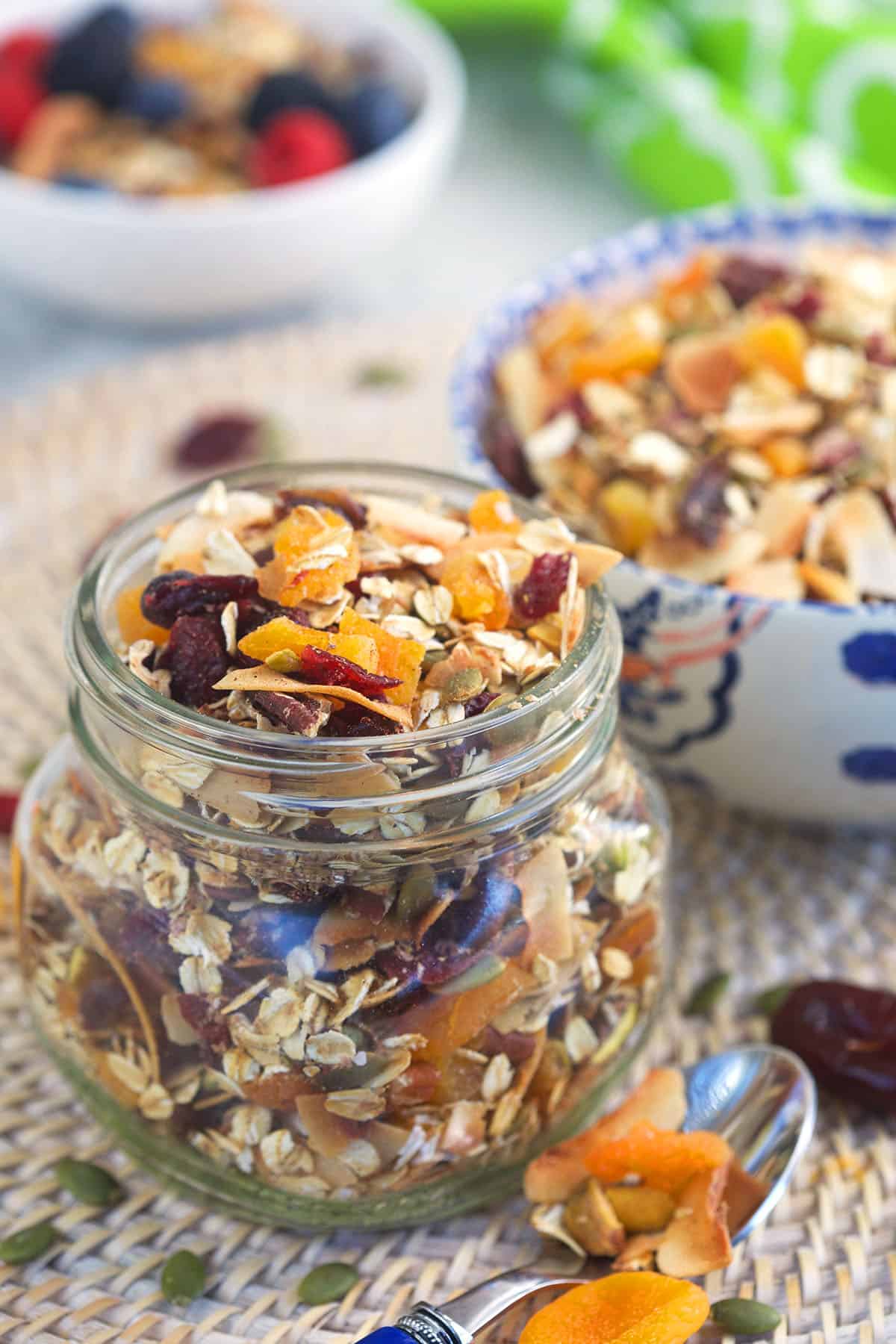 A jar of Muesli is placed on a place mat.