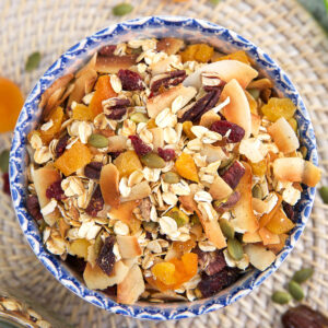 A blue and white bowl is filled with muesli.