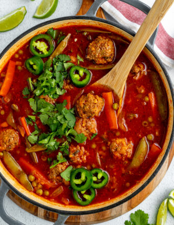 A pot is filled with albondigas soup.