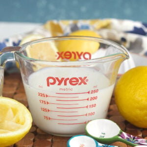A pyrex measuring cup is filled with buttermilk.