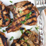Parsley garnishes several pork chops.