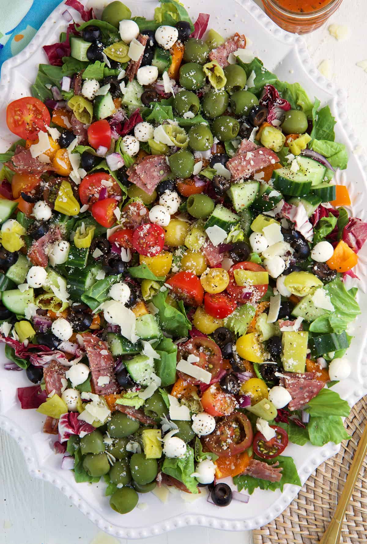 A large serving platter is filled with chopped salad.