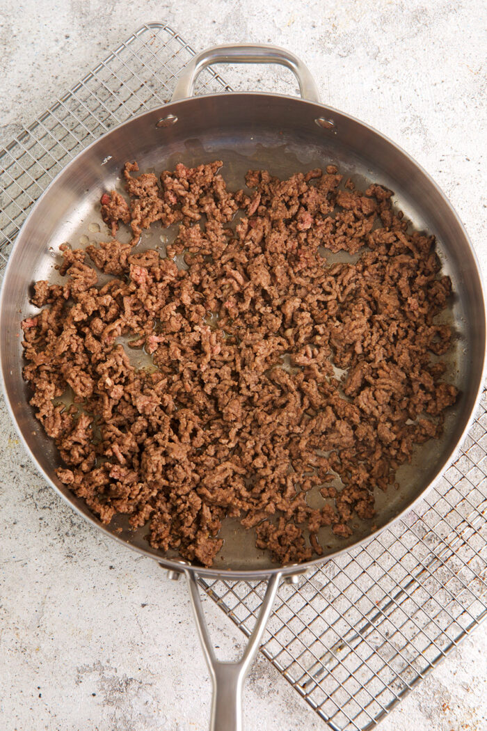 Overhead view of browned ground beef in skillet