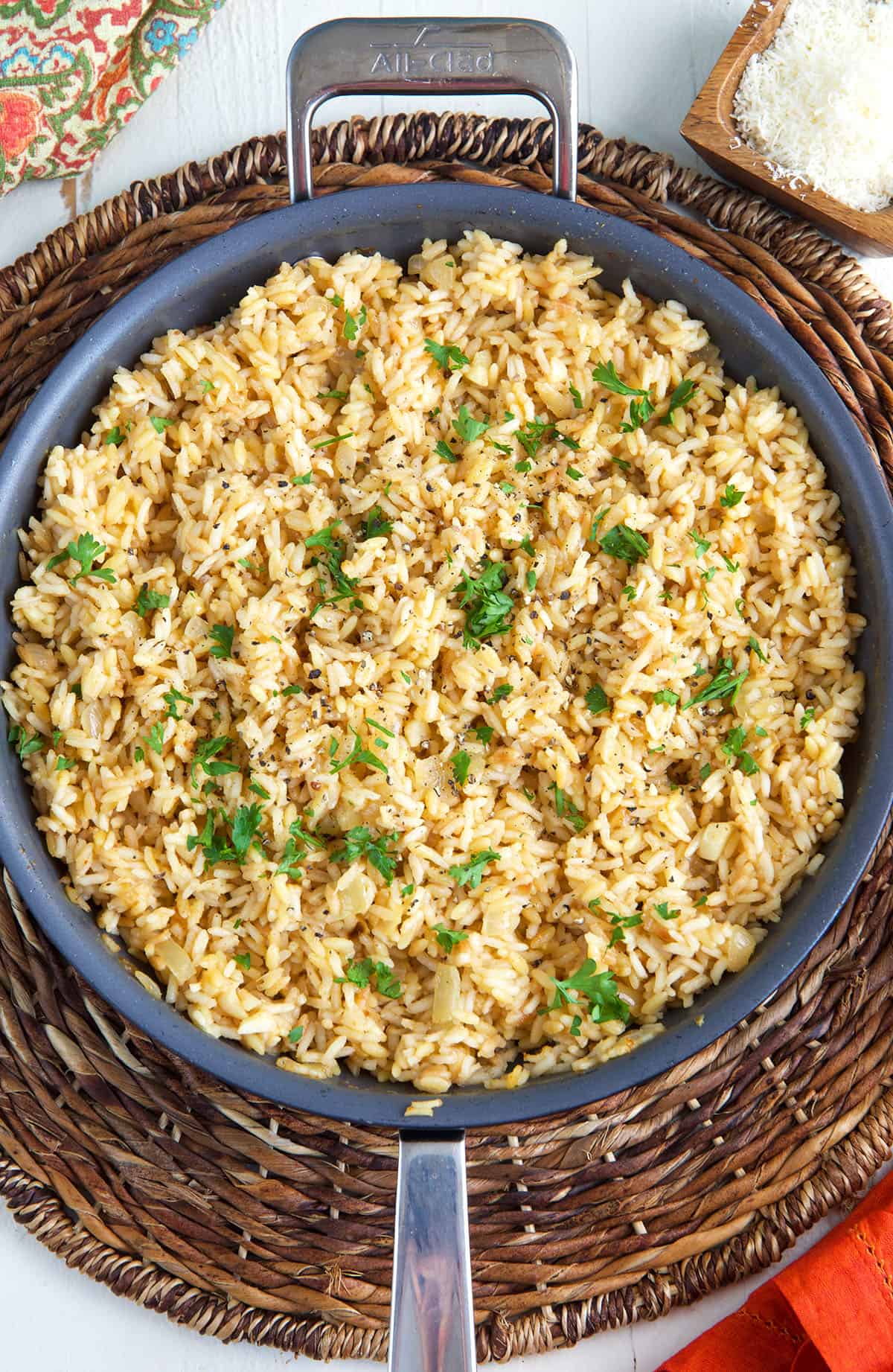 A large skillet is filled with cooked rice pilaf. 