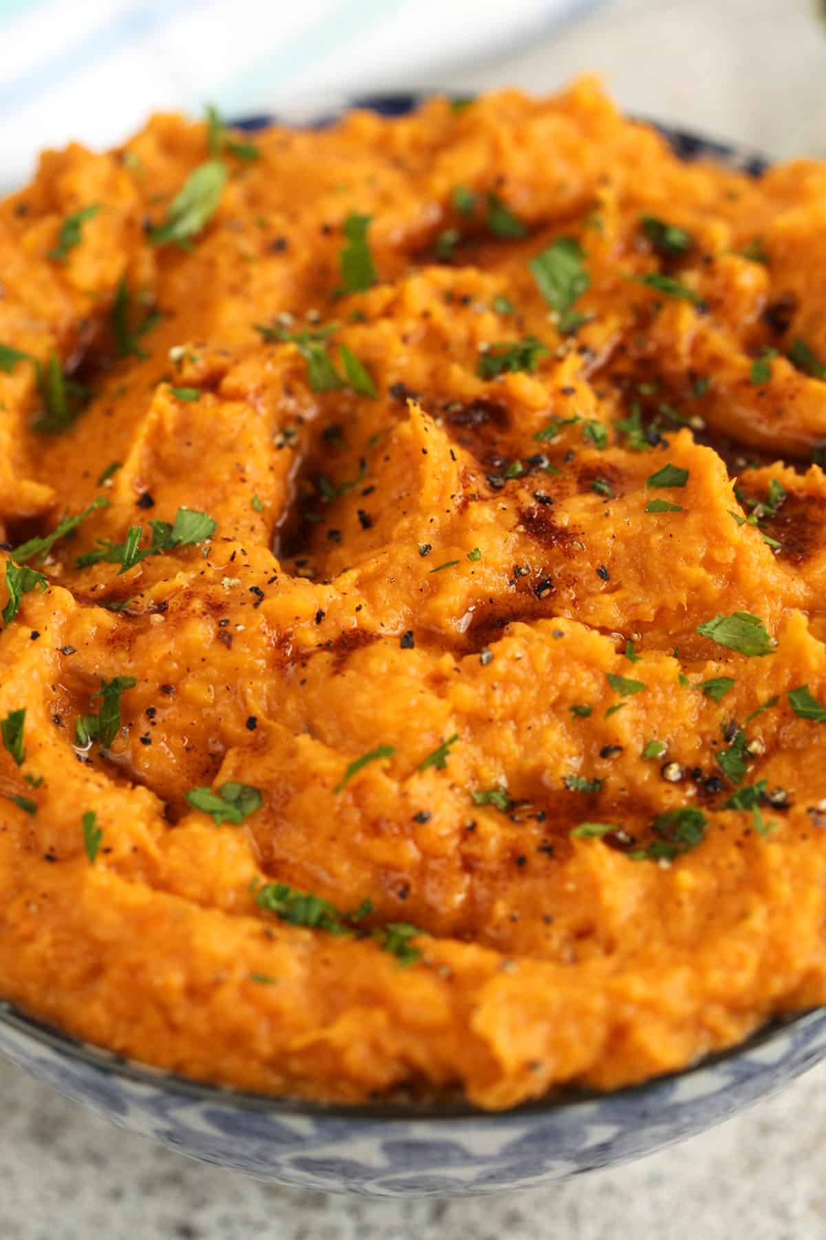 Creamy mashed sweet potatoes in serving bowl