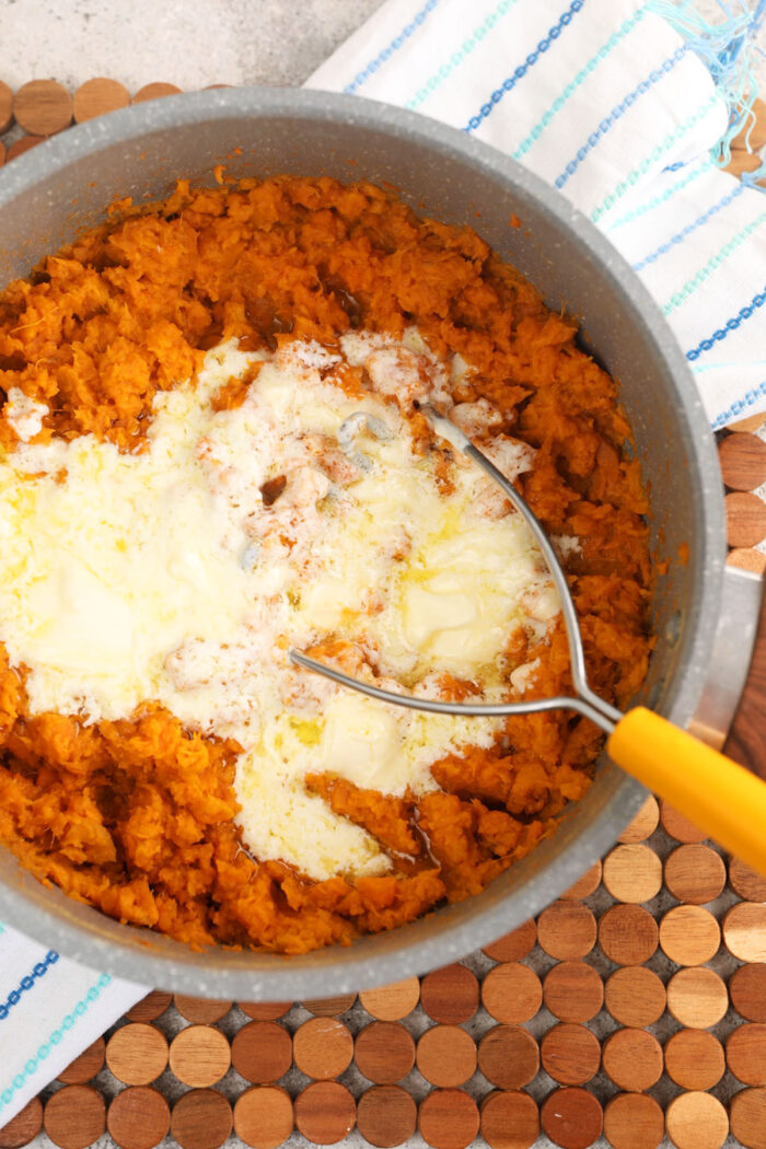 Mashing mascarpone into sweet potatoes