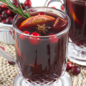A glass mug is filled with mulled wine.