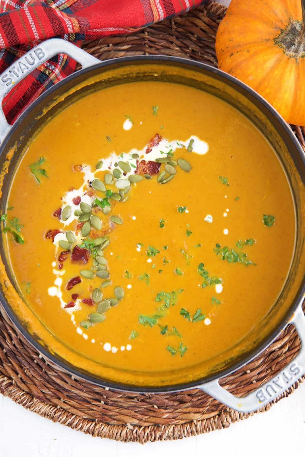 A large pot is filled with pumpkin soup. 