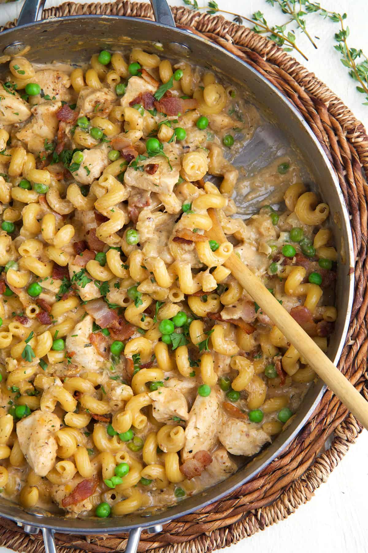 A skillet is filled with chicken bacon ranch pasta. 