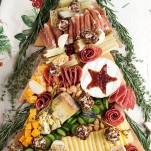 A Christmas charcuterie board is presented on a white surface.