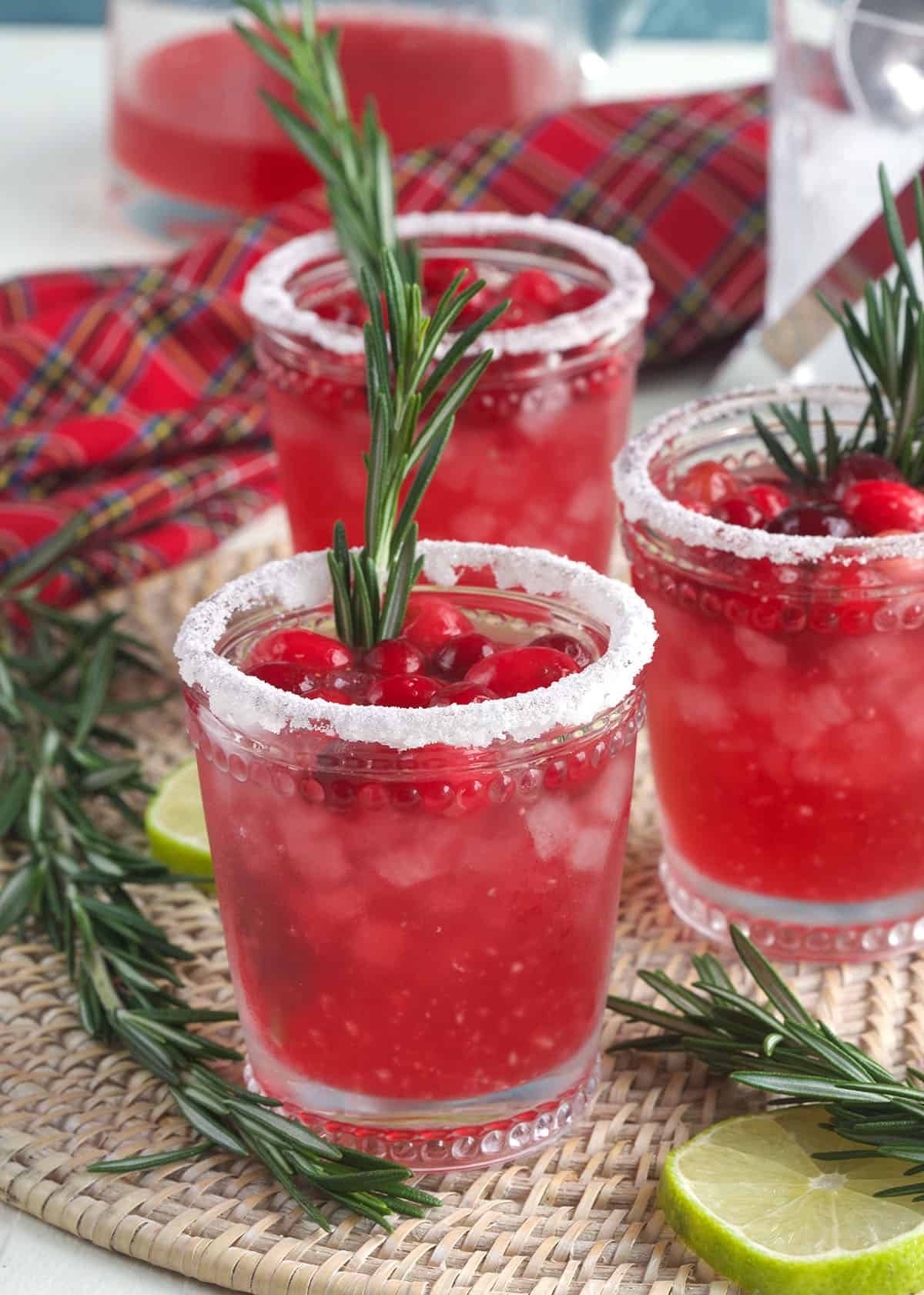 Several glasses are garnished and rimmed with sugar. 