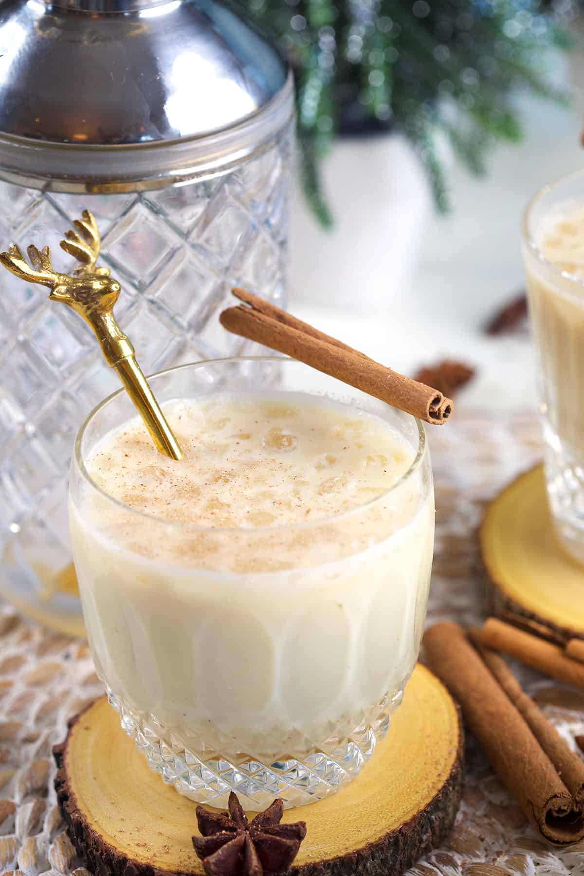 A reindeer stirrer is placed in a cup of eggnog white russian. 