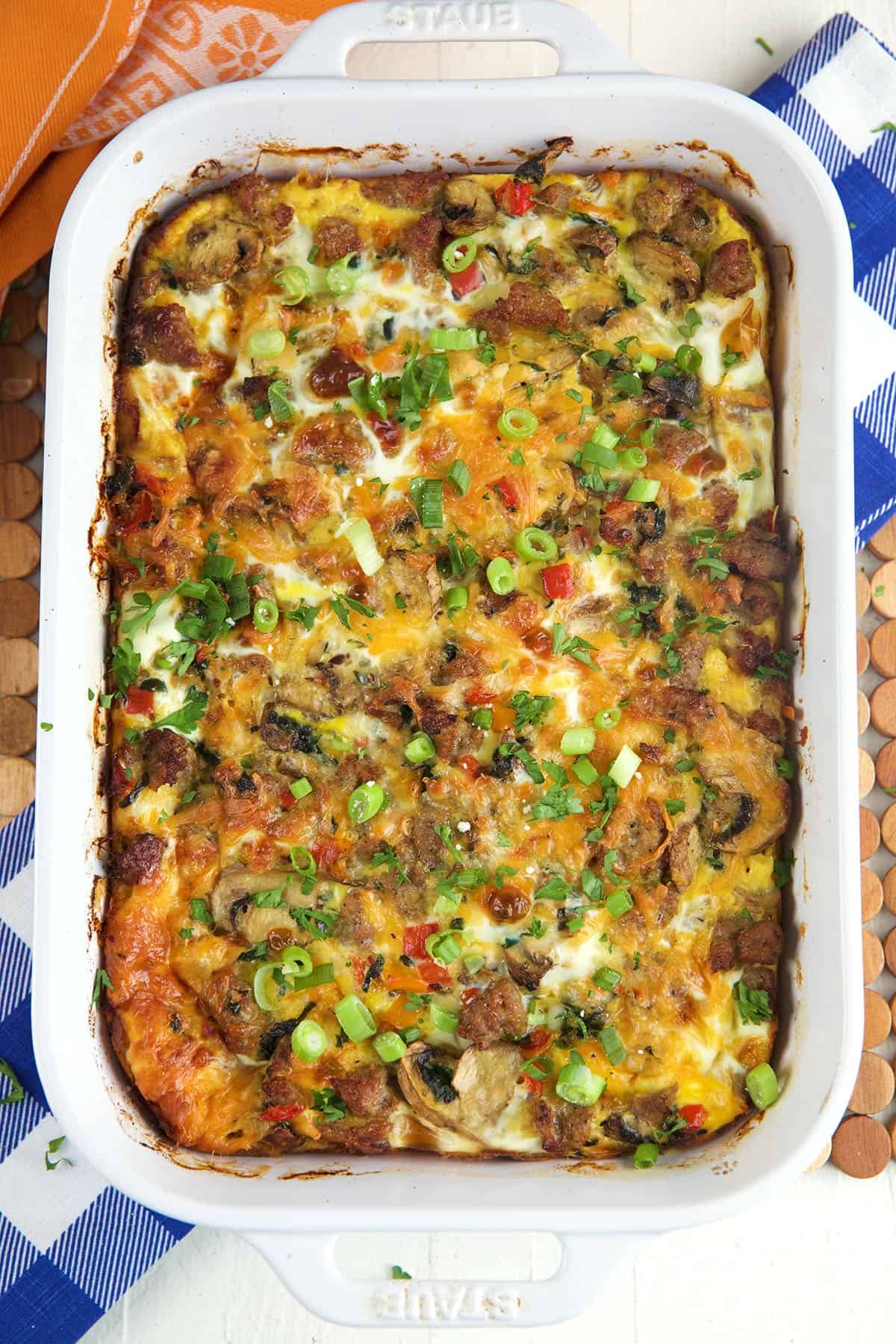 A casserole dish is filled with baked breakfast casserole. 