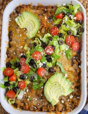 A casserole dish is filled with taco casserole.