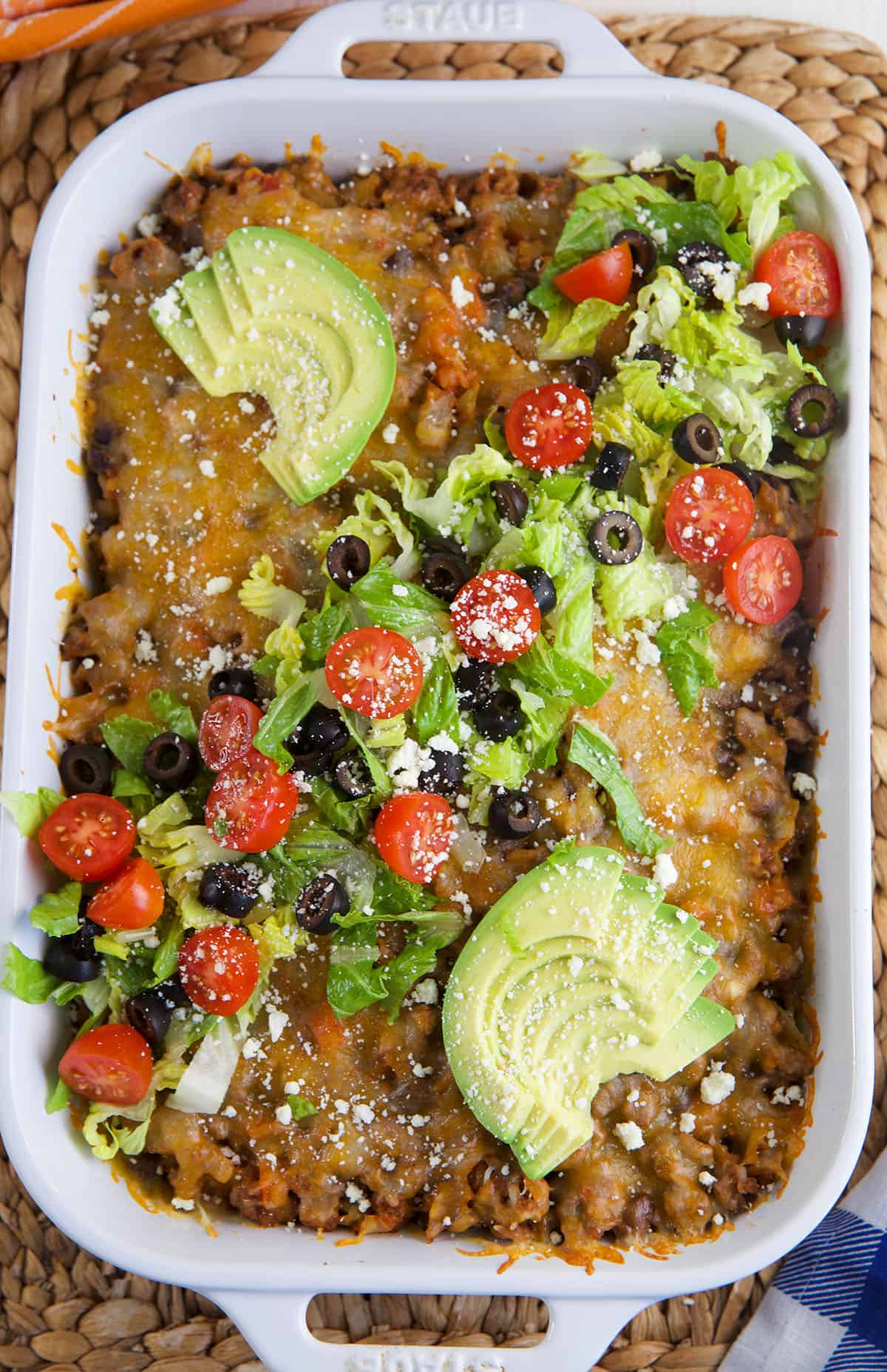 A casserole dish is filled with taco casserole. 