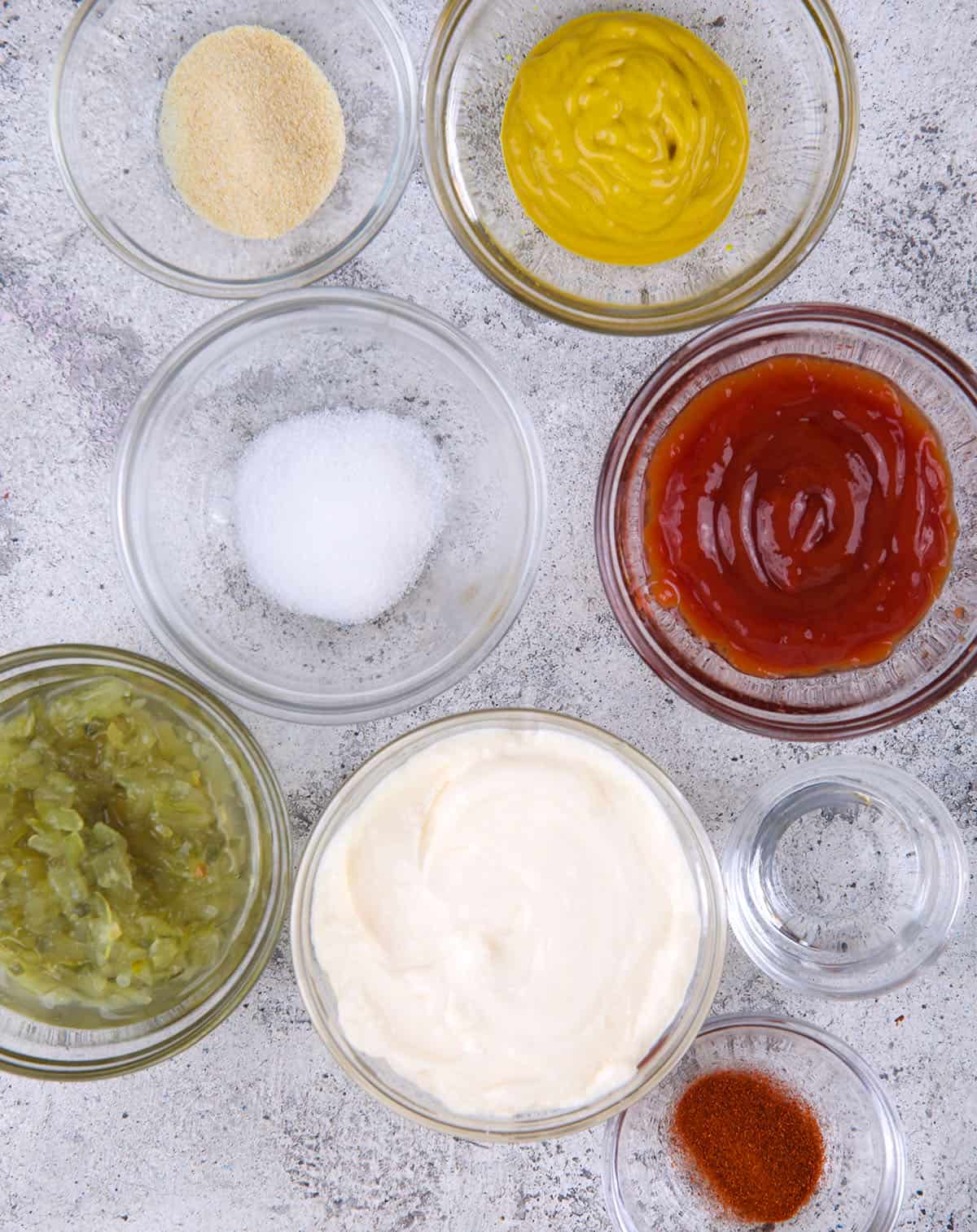 All of the ingredients for big mac sauce are spread out on a counter. 