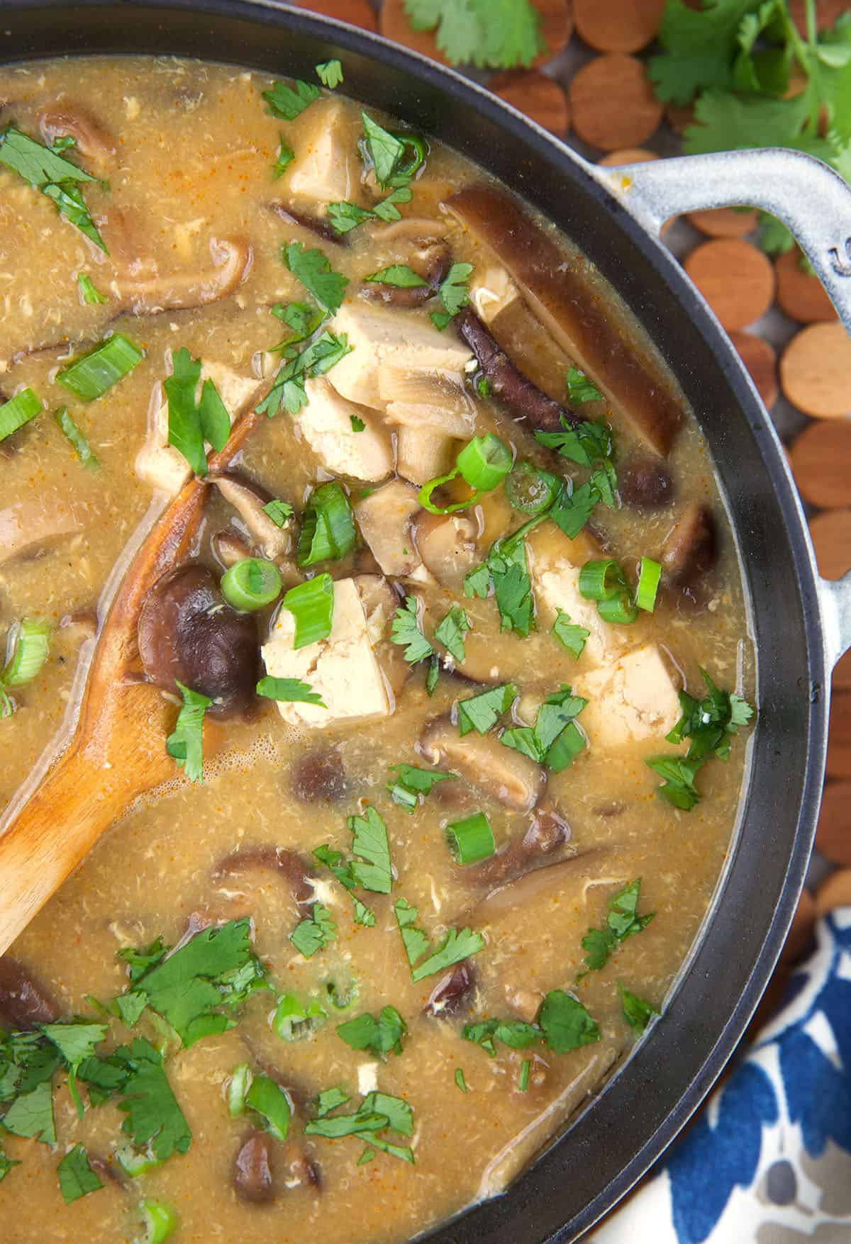 A pot is filled with hot and sour soup. 