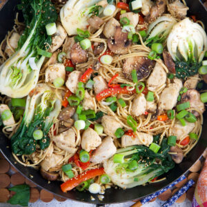 A skillet is filled with chicken chow mein.