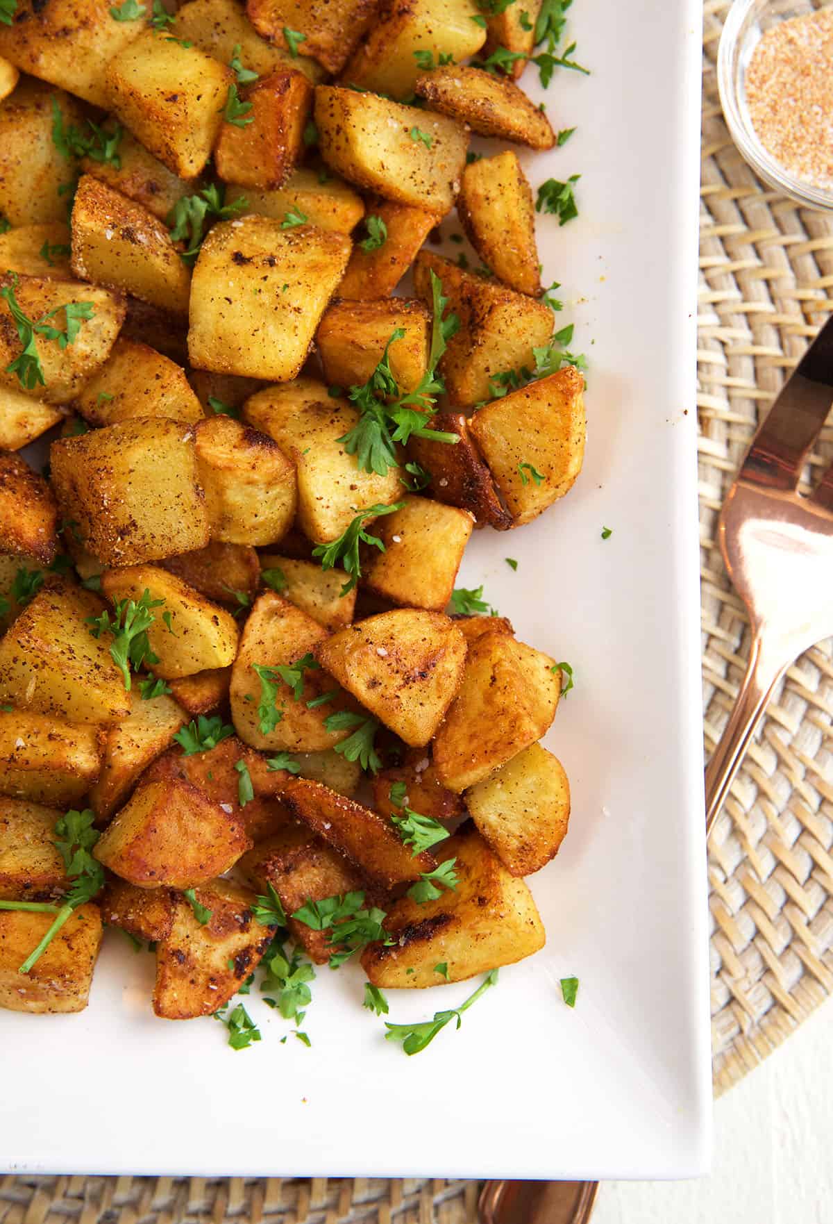 Potatoes are garnished with fresh herbs. 