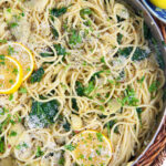 A skillet is filled with lemon pasta.