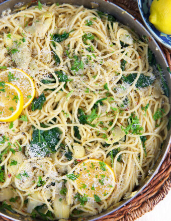 A skillet is filled with lemon pasta.