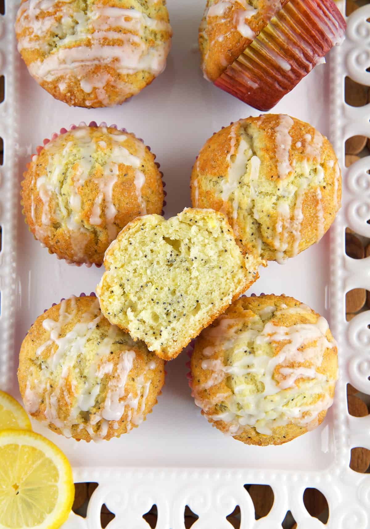 A halved lemon poppy seed muffin reveals a fully cooked center. 