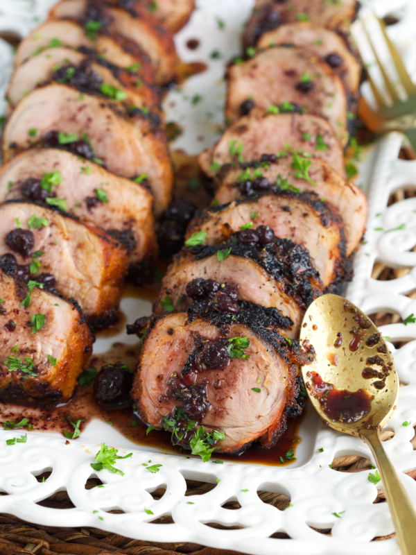 A spoon is placed next to sliced tenderloin.