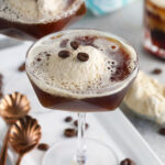 Coffee beans garnish two martinis.