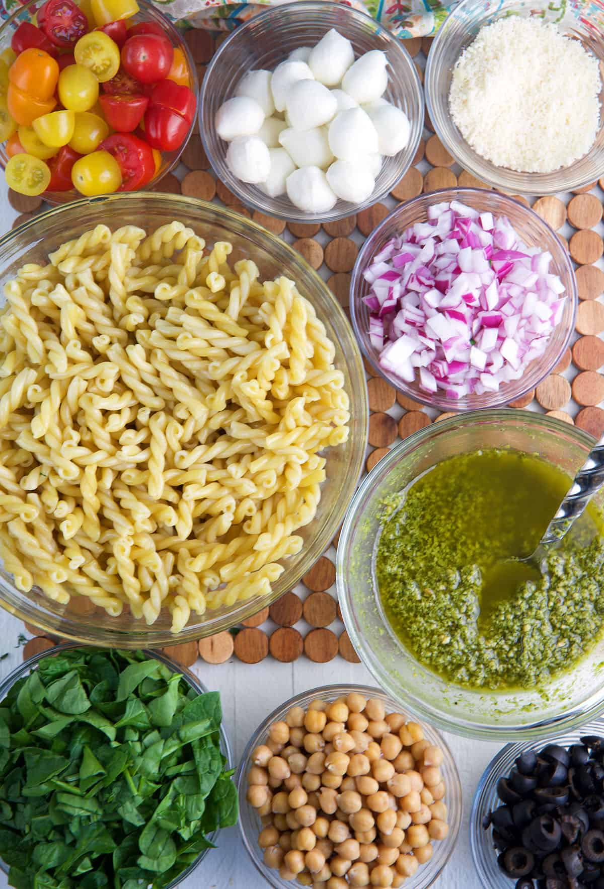 The ingredients for pesto pasta salad are presented. 